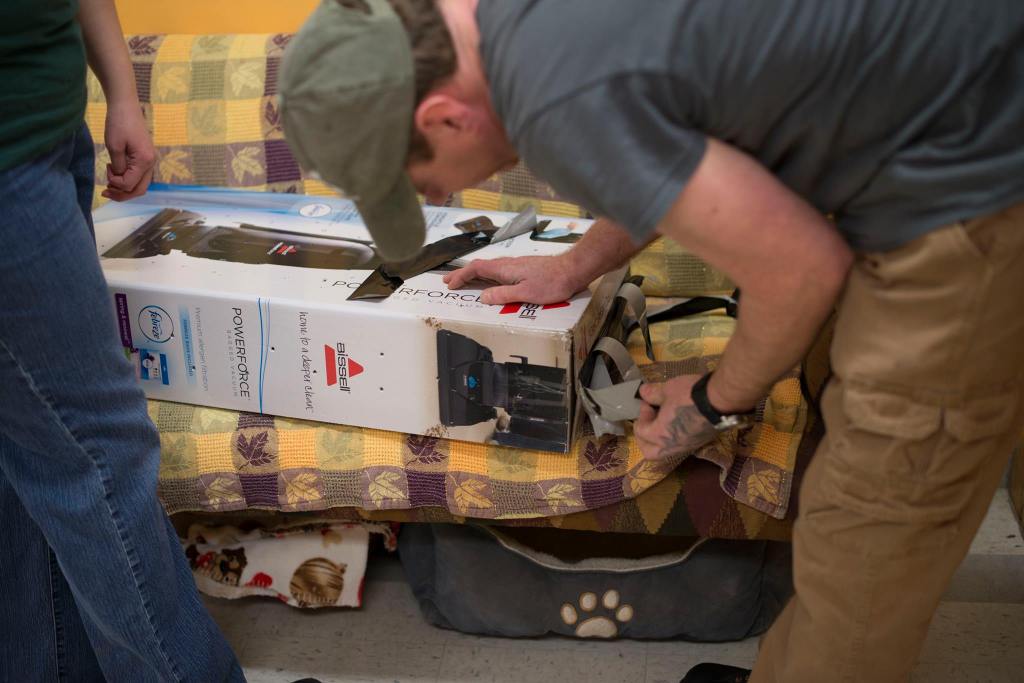 Staff open a vacuum cleaner box to find a surprise kitten inside. The box was left outside at the front door of the Franklin County Animal Shelter Thursday. 