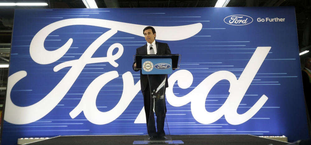 Ford Motors CEO Mark Fields tells workers in Flat Rock, Mich., that the company will invest $700 million in the plant to make hybrid, electric and autonomous vehicles.