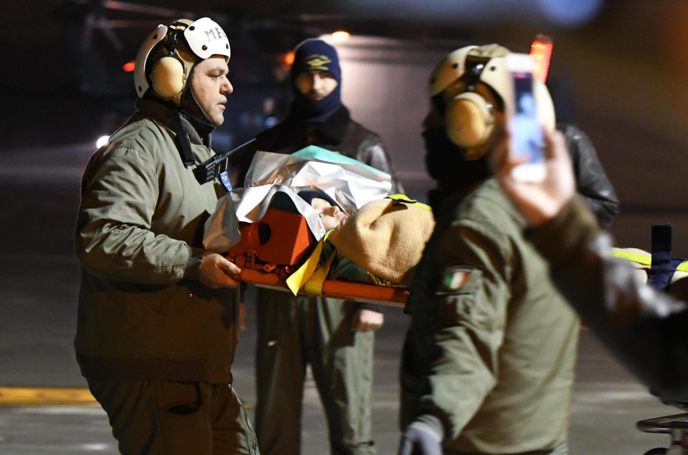 A child rescued from the Hotel Rigopiano is taken to a hospital in Pescara, Italy, two days after an avalanche dumped 16½ feet of snow on the resort.