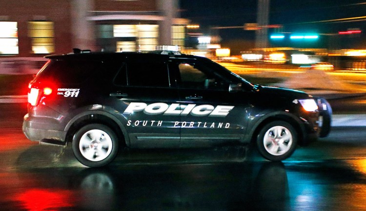 A South Portland police vehicle leaves the police station Wednesday night. The city's officers will soon be equipped with body cameras.