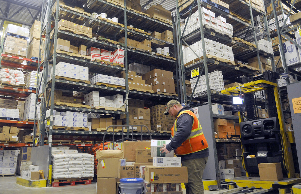 Performance Foodservice — NorthCenter employee Dan Worth at the warehouse in Augusta on Dec. 20.