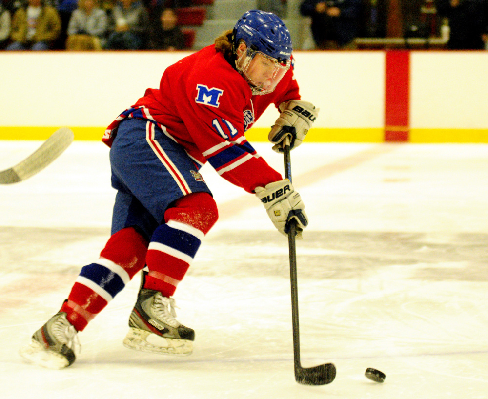 Messalonskee's Dustin Brown skates with the puck during a game against Maranacook/Winthrop on Wednesday at Bonnefond Ice Arena in Kents Hill.