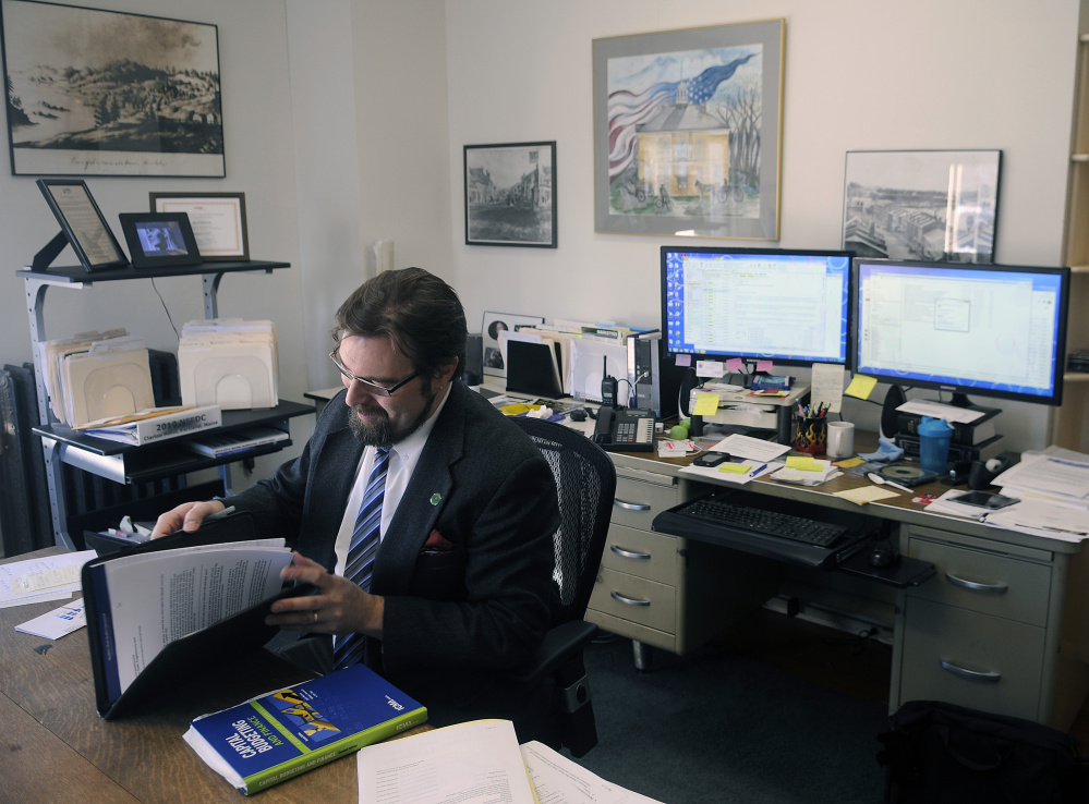 Hallowell City Manager Nate Rudy sits at his desk last week at City Hall.