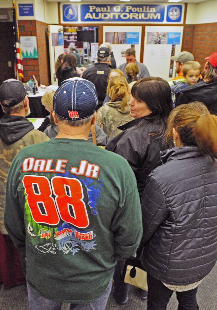 Motorsports enthusiasts, including Benton native Howard White, wait in line to enter the Northeast Motorsports Expo last year in the Augusta Civic Center. The annual show returns to the Civic Center on Friday.