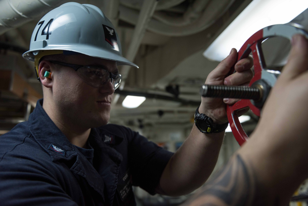 Damage Controlman 3rd Class Sean Cote, from Winslow, Maine, aligns an aqueous film forming foam (AFFF) transfer station for recirculation aboard the aircraft carrier USS John C. Stennis (CVN 74) during periodic maintenance. John C. Stennis is currently in port preparing for a planned incremental availability.