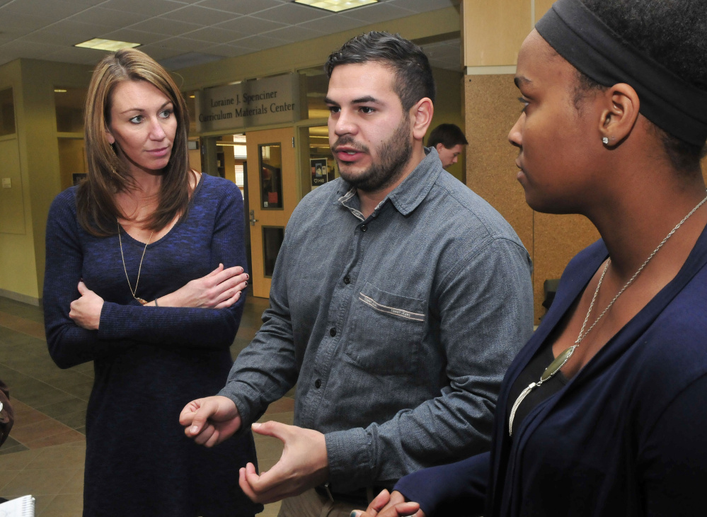 University of Maine Farmington students, from left, Melissa Sawyer-Boulette, Ronie Moralis and Rhiannan Jackson Monday discuss the successful application they helped write that resulted in Skowhegan Savings Bank awarding the Western Maine Homeless Outreach shelter in Farmington a $5,000 grant.