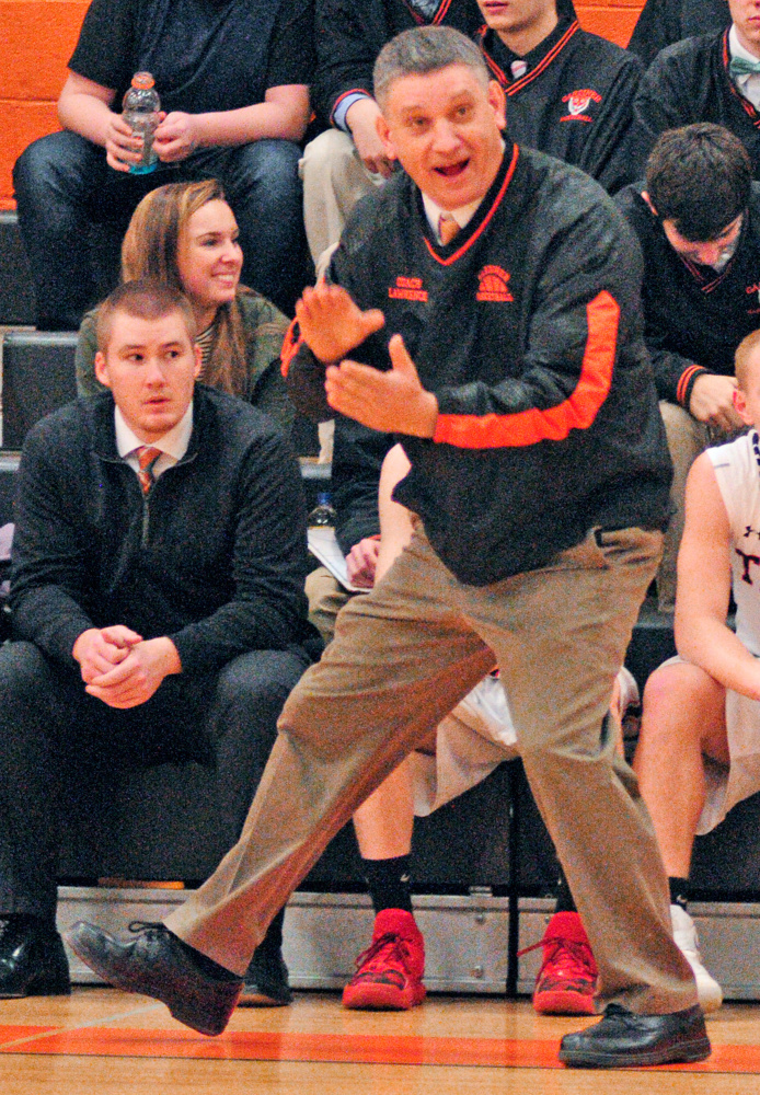 Staff photo by Joe Phelan 
 Gardiner interim coach Charlie Lawrence shouts encouragement to his team in a game against Hampden on Tuesday night in Gardiner.