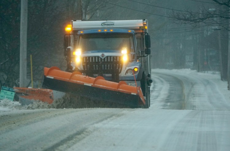 A snowplow makes its way along Sea Road in Kennebunk on Jan. 24. 