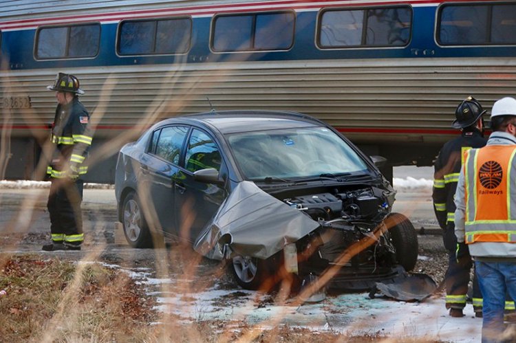 Police have charged the driver of this that was hit by a Downeaster train Friday at the crossing on Brighton Avenue near St. John Street.