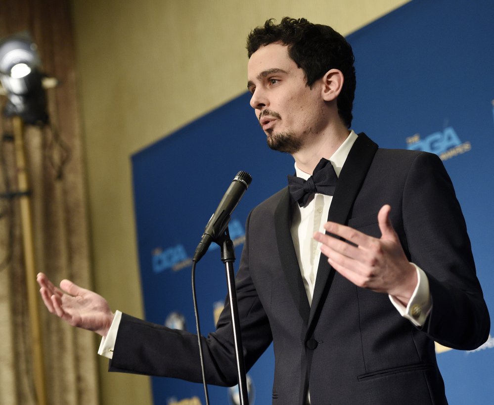 Damien Chazelle, winner of the Directors Guild award for "La La Land," talks to reporters backstage in Beverly Hills.