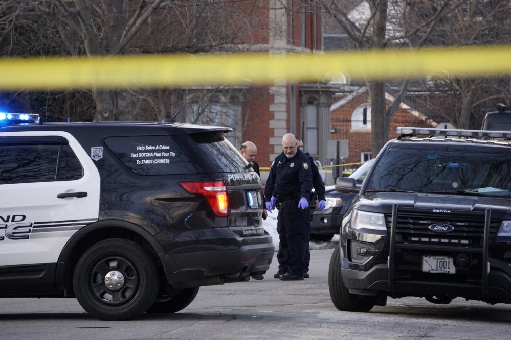 Portland police investigate the scene where Bryan K. Garcia of Scarborough died Monday on Chadwick Street in Portland.