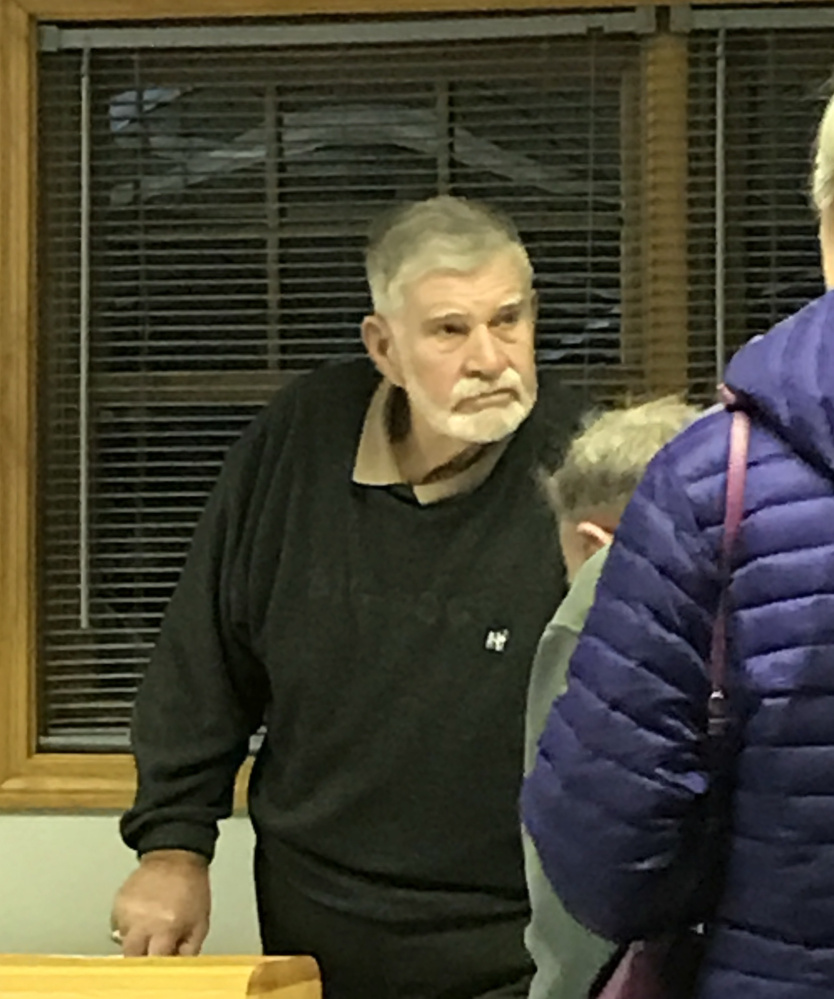 Special town meeting moderator James Lotheridge oversees ballots cast Wednesday in a vote on whether to ban marijuana enterprises in Pittston.