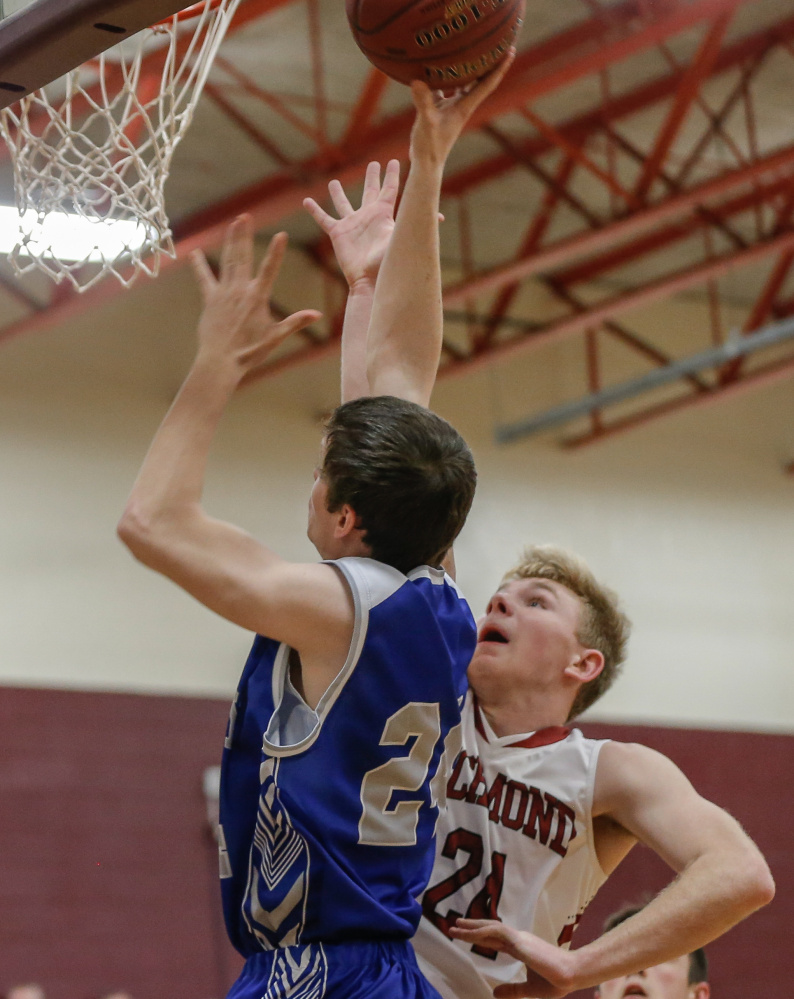 Valley's Austin Cates goes up strong to the basket as Richmond's Brendan Emmons defends during an East/West Conference game Wednesday night in Richmond.