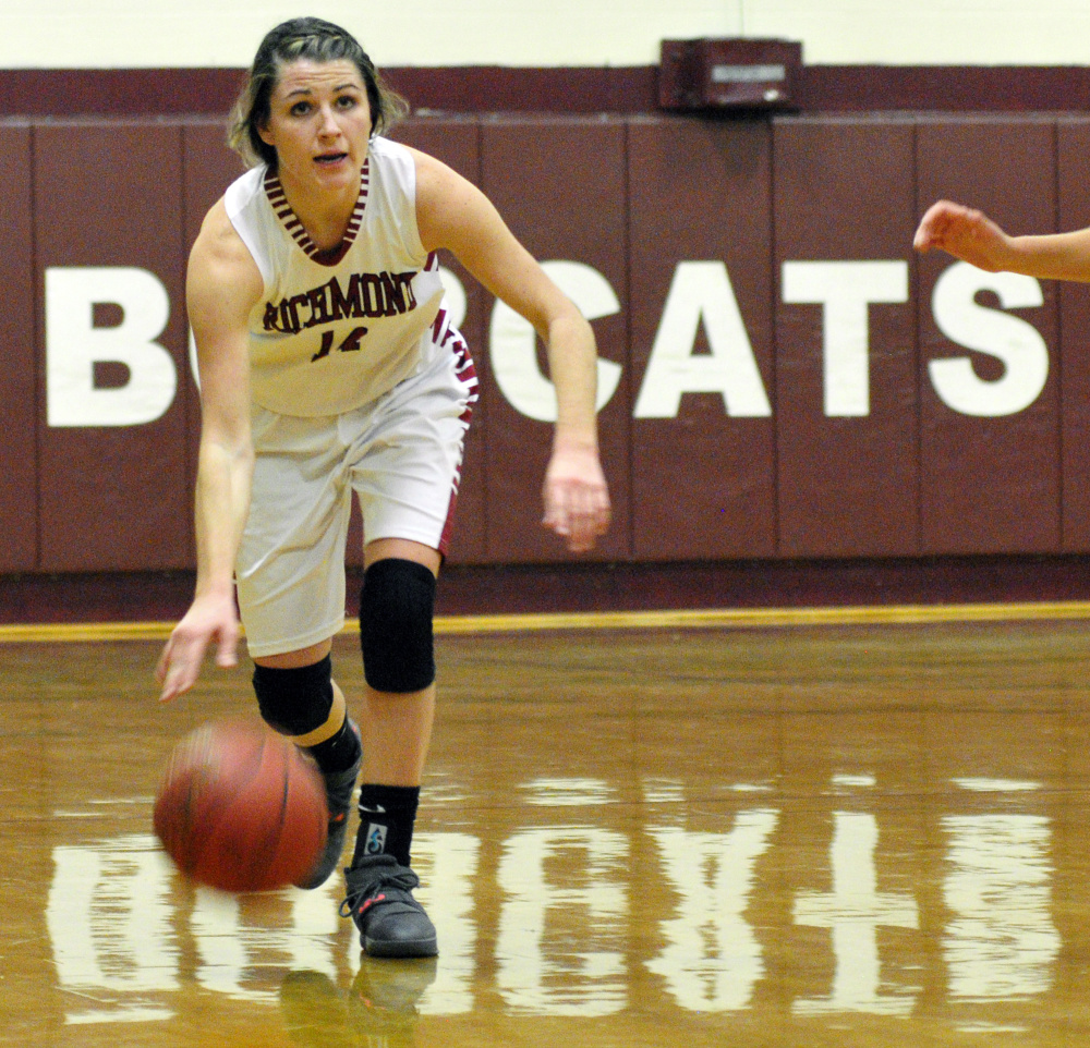 Richmond's Meranda Martin dribbles up the court against Rangeley in Richmond.