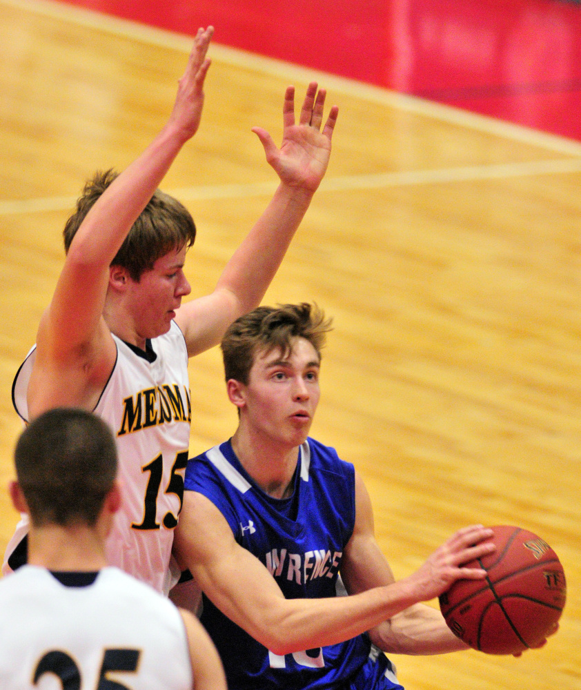 Medomak's Kyle Donlin, left, defends Lawrence forward Mason Cooper during a Class A North quarterfinal last season at the Augusta Civic Center.