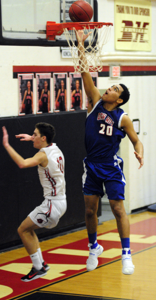 Oak Hill's Darryn Bailey puts in a layup off a fast break during a Mountain Valley Conference game against Hall-Dale last month in Farmingdale.