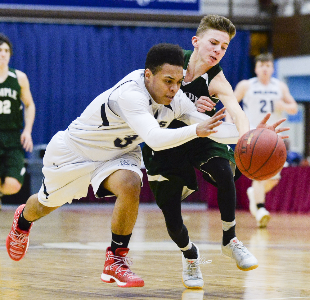 Temple's Micah Riportella fights to recover the ball after Gould's Tyrese Collins attempted a steal in the third quarter of a Class D South quarterfinal Saturday in Augusta. The Bereans fell to the Bears 76-63.