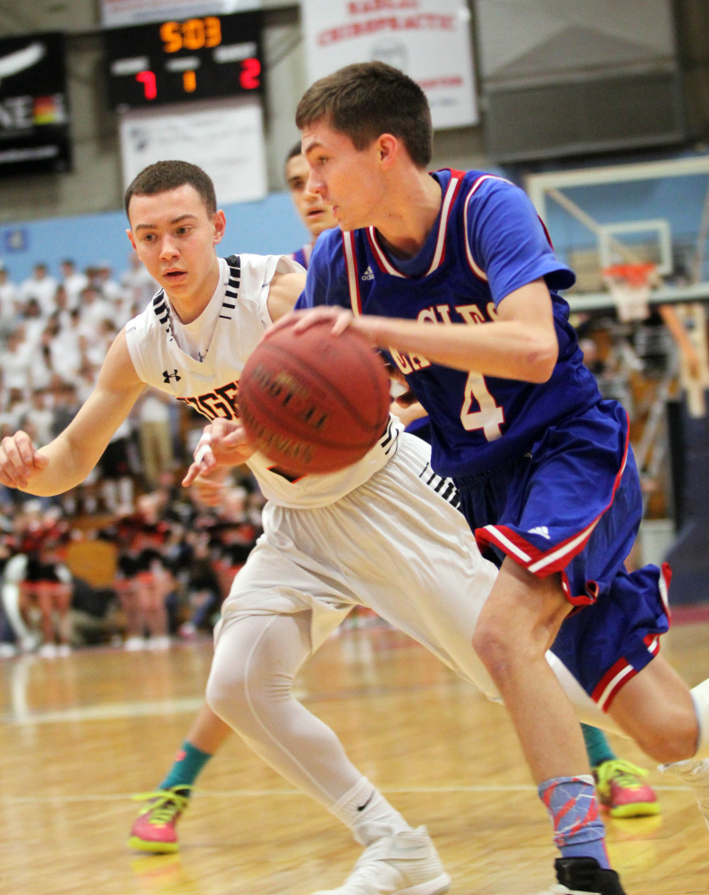 Messalonskee's James Kouletsis drives to the basket during a Class A North quarterfinal against Gardiner last Saturday at the Augusta Civic Center.