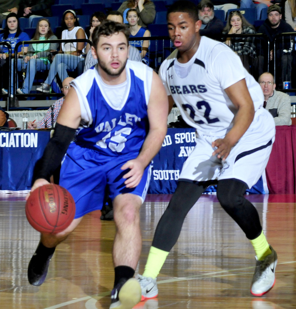 Valley's Brandon Thomas dribbles past A.R. Gould's Issak Aliyow during a Class D South semifinal Wednesday at the Augusta Civic Center.