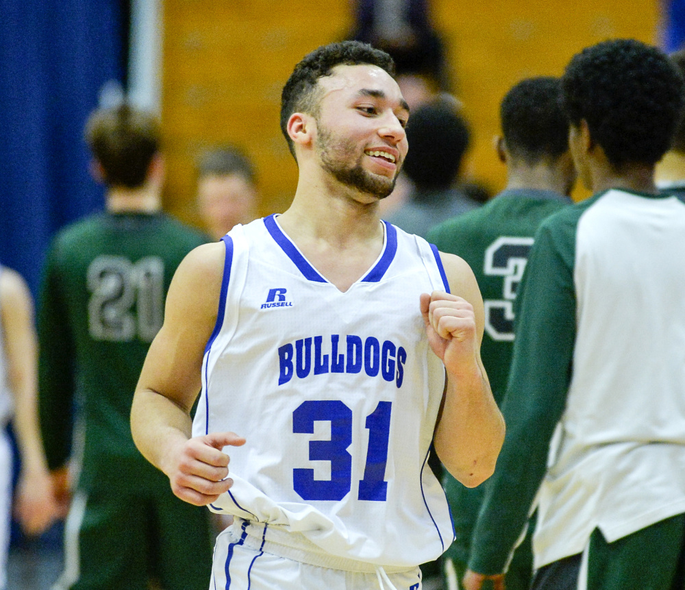 Madison's Morales fist-pumps after a stunning 52-47 win over Waynflete Thursday in a Class C South semifinal. Morales scored 18 points.