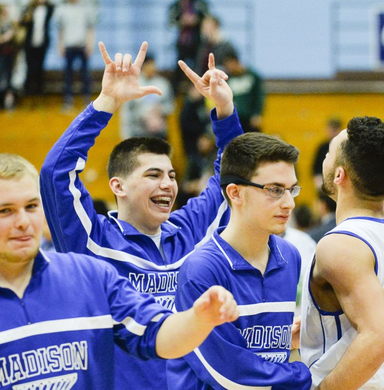 Madison's Eric Wescott celebrates with Nick Morales after the Bulldogs sank Waynflete 52-47 in a Class C South semifinal Thursday at the Augusta Civic Center.