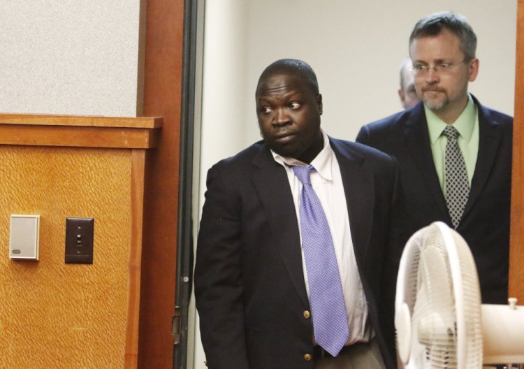 Gang Deng Majok enters a Portland courtroom Friday. He pleaded guilty to shooting Nasir Hirad outside Sangillo's Tavern in 2014, and was sentenced to 20 years in prison as part of an agreement with prosecutors.