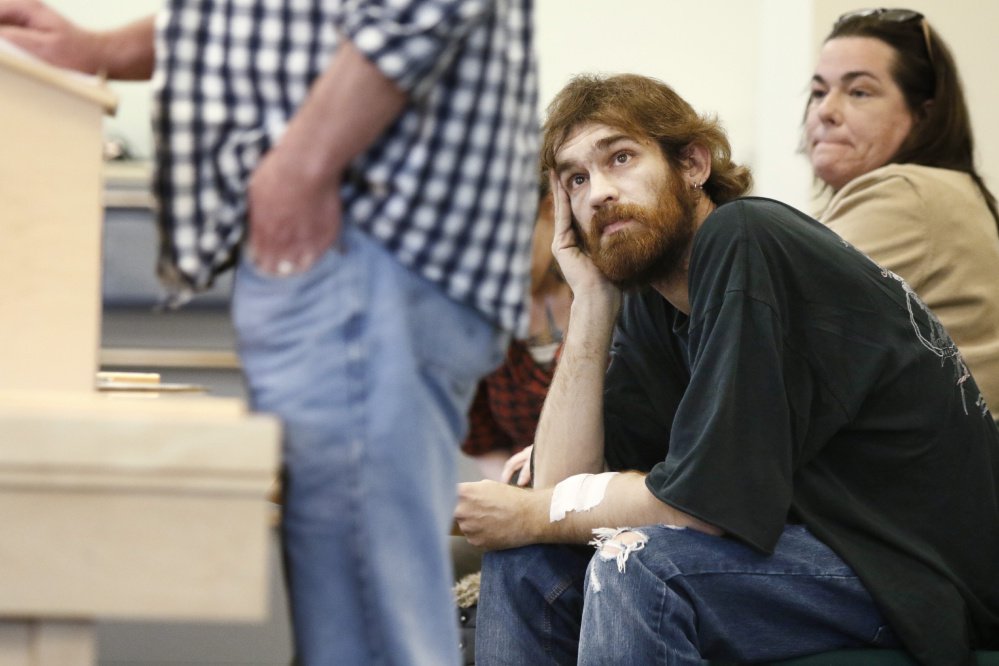 Garry Godfrey of Milford listens as Dawson Julia testifies before a legislative committee in support of a bill to prohibit policies excluding medical marijuana patients from organ donations. Julia is a medical marijuana caregiver in Unity.