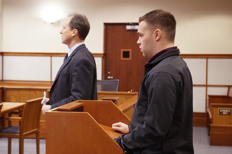 Nicholas Perry makes his initial appearance with his attorney at Cumberland County Courthouse on Wednesday on a charge of inappropriate contact with a Bonny Eagle High School student while he was cheering coach at the school. Perry entered no plea and his $5,000 bail, which he posted at the time of his arrest in January, was continued. 