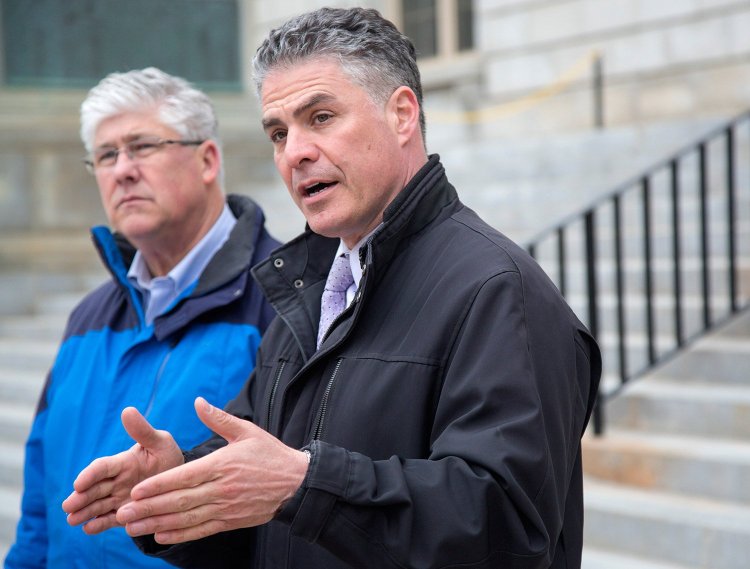 Portland Mayor Ethan Strimling, accompanied by City Councilor Nicholas Mavodones, announces a compromise on a multimillion-dollar borrowing plan to make improvements to the city's elementary schools. City leaders would place competing projects on the ballot and let voters decide.