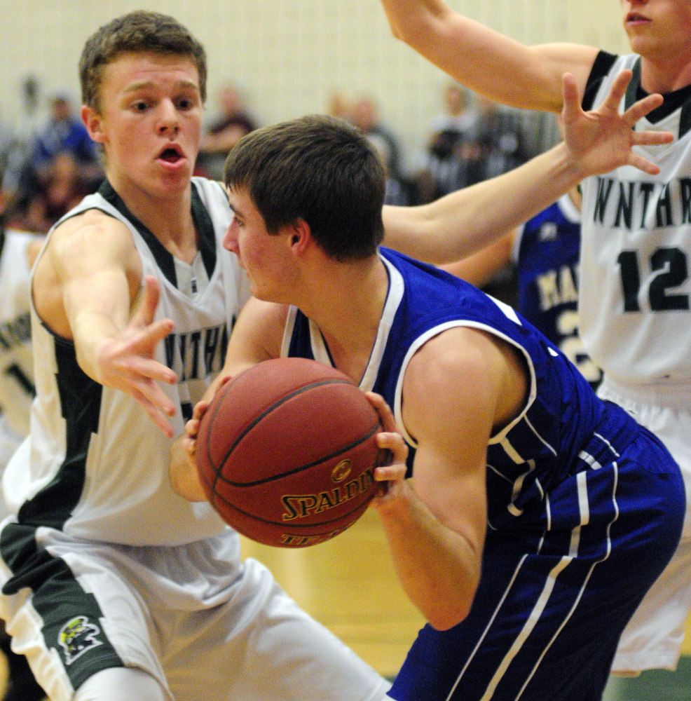 Winthrop's Nate LeBlanc, left, defends Madison's Sean Whalen during a regular season game earlier this winter in Winthrop. LeBlanc has provided a boost off the bench in the Ramblers' run to the state championship game.