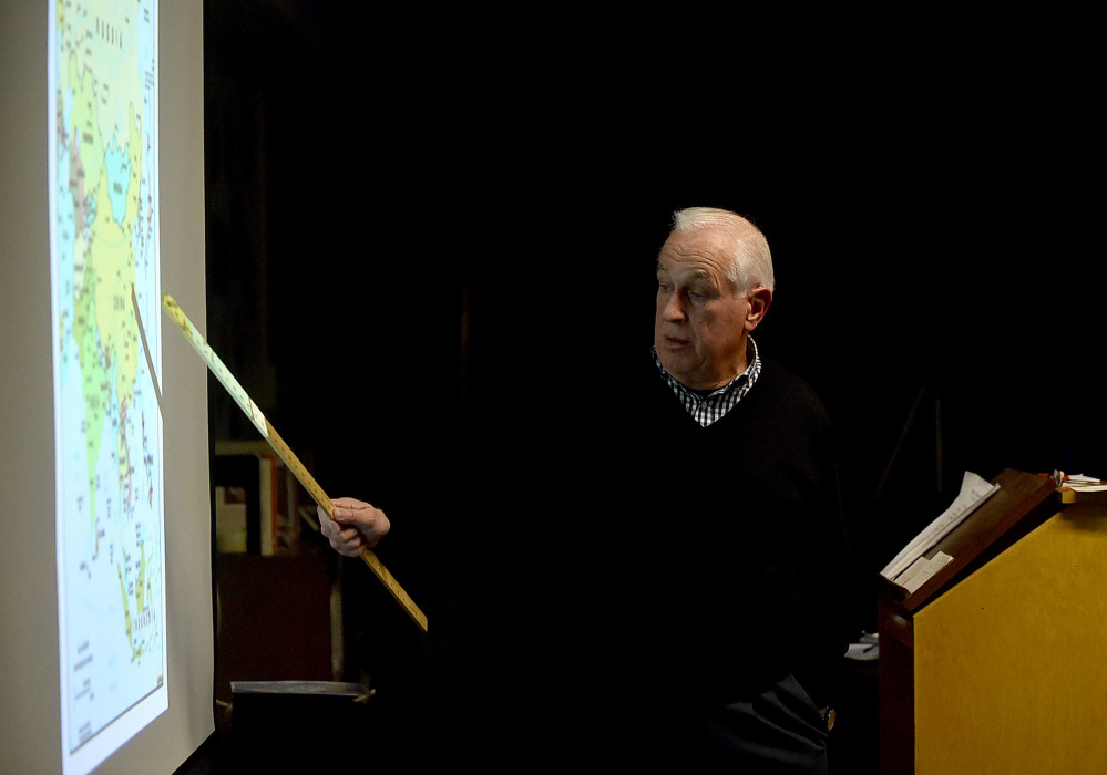 Douglas Cotchin, president of the Fairfield Historical Society, gives a presentation on the life of local hero Eugene Wing on Wednesday at the Lawrence Junior High School library in Fairfield.