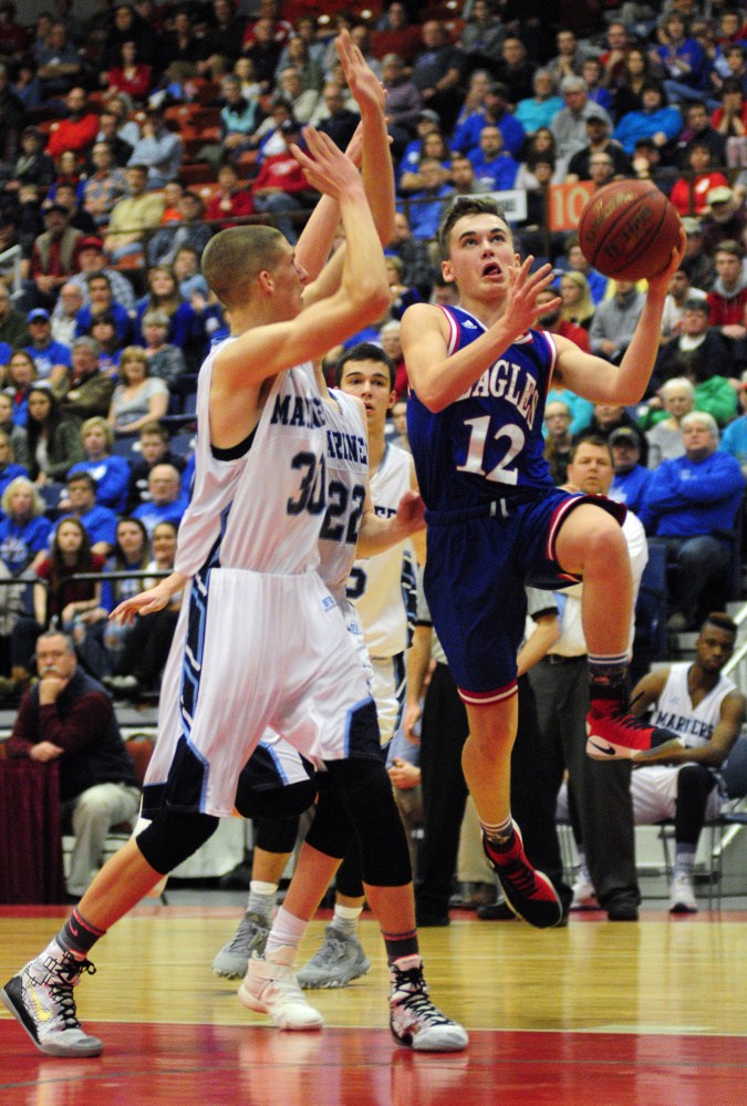 Messalonskee freshman guard Tucker Charles goes up for a shot during the Class A North championship game last Friday at the Augusta Civic Center.