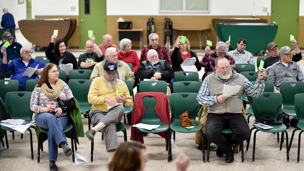 Anson residents vote down two articles Saturday during Town Meeting at Carrabec High School in Anson.