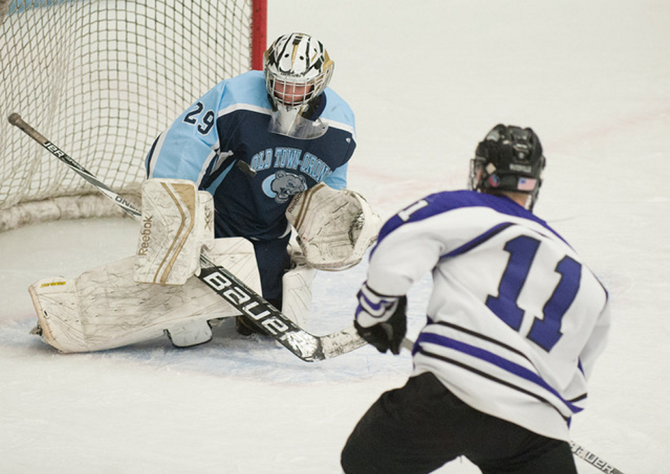 Kevin Bennett photo 
 Old Town/Orono's Brenden Gasaway stops a shot by Waterville's Jackson Aldrich during the Class B North final Tuesday in Orono.