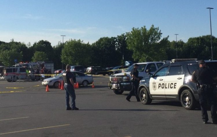 Police gather at the Augusta Wal-Mart parking lot on June 26, 2016, after a dispute over money and drugs led to shots being fired.