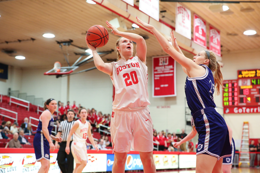 Boston University freshman Nia Irving goes up for a shot as Holy Cross freshman Lauren Manis defends during a Feb. 25 game in Boston.