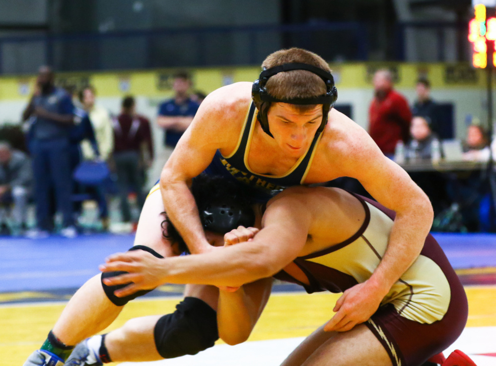 Dan Del Gallo, of the University of Southern Maine, wrestles Walter Ordnez of Springfield Technical during a match this season.