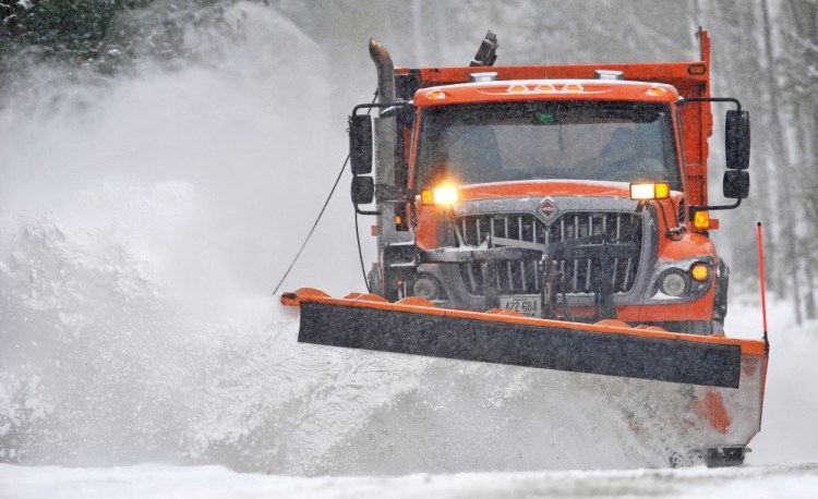 A plow truck with the Waterville Public Works clears fresh snow during a storm in February. A late-winter storm Tuesday into Wednesday is forecast to bring a foot or more of snow to central Maine.