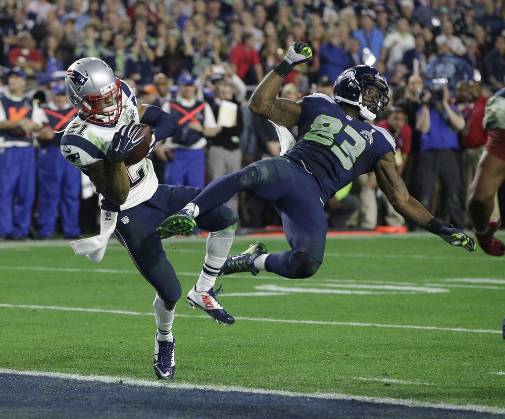 New England Patriots strong safety Malcolm Butler (21) intercepts a pass intended for Seattle wide receiver Ricardo Lockette during the second half of Super Bowl XLIX in Glendale, Arizonq. The Patriots restricted free agent cornerback has scheduled a visit with the New Orleans Saints at the team's headquarters on Thursday.