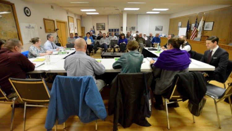 City council members open the budget meeting at the City Chambers in Waterville on Tuesday.
