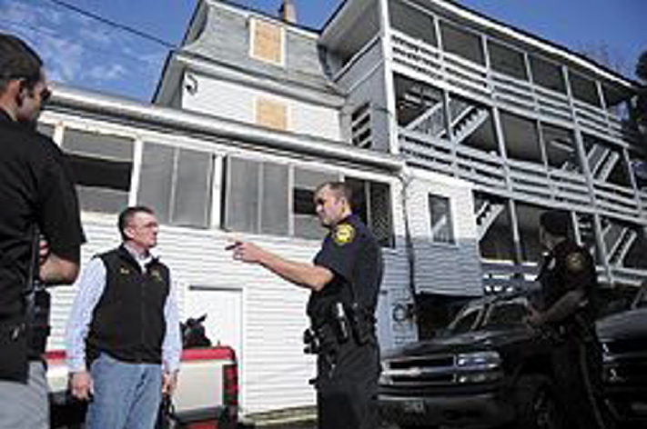 Augusta officials confer in 2013 outside the apartment building at 3 Jefferson St. after the city closed it and another apartment building at 1 Jefferson St. because of code violations. The Augusta Housing Authority now has money available to help apartment building owners who could use some financial help rehabilitating and addressing code problems in their rental properties.