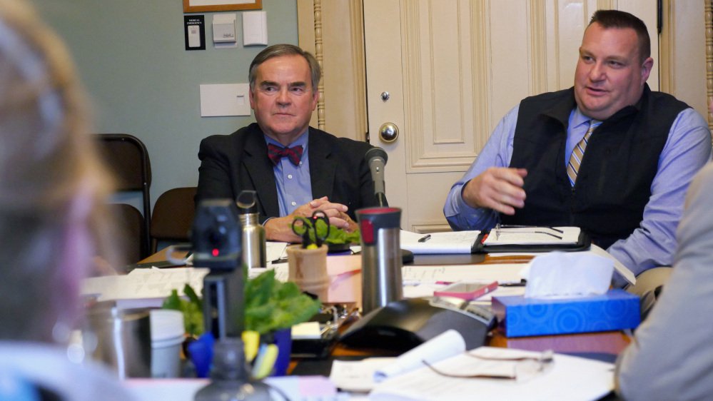 Vermont's Department of Motor Vehicles Commissioner Robert Ide, left, and DMV enforcement director William Elovirta testify before the state's Senate Government Operations Committee in Montpelier, Vt., on Tuesday.