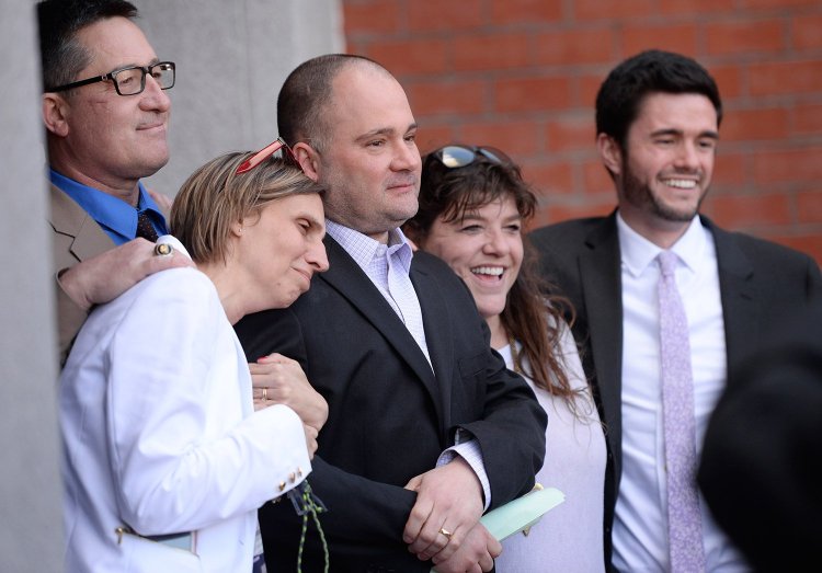 Michelle Sanborn, left, Anthony Sanborn Jr., and attorney Amy Fairfield celebrate after Anthony Sanborn is released on bail from Cumberland County Jail on April 13. 