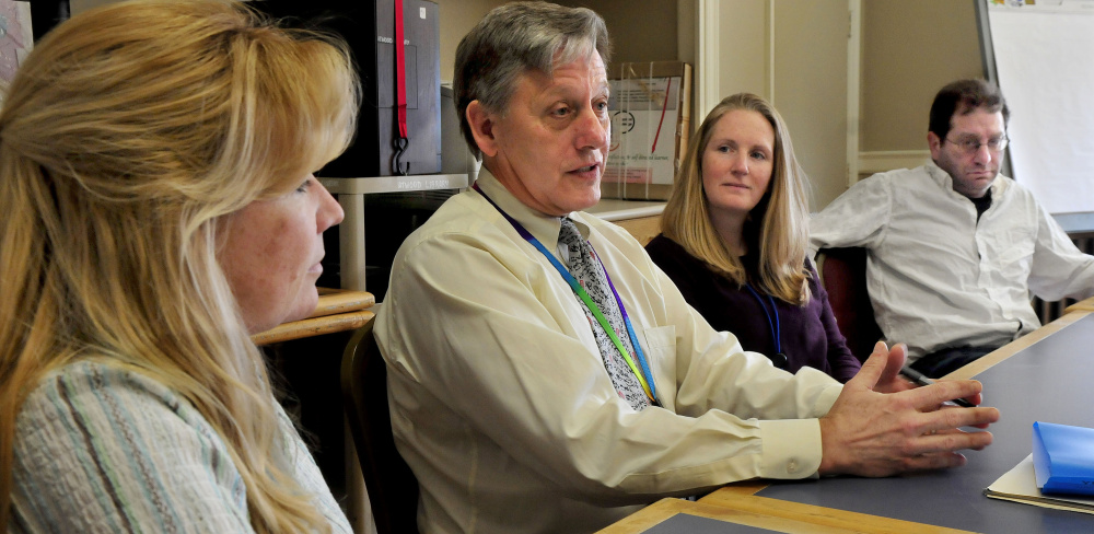 From left, Regional School Unit 18 Director of Special Services Cheryl Mercier, Superintendent Gary Smith, social worker Angela McMahon and special education teacher Scott Talcove discuss budget issues Wednesday.