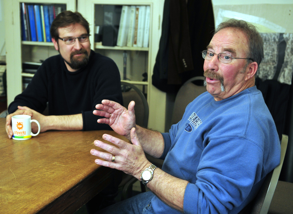 Hallowell City Manager Nate Rudy, left, listens as fire Capt. Richard Clark speaks during an interview Wednesday in Hallowell City Hall.