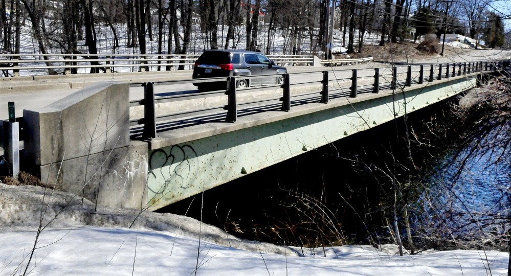 Traffic passes over Thayer Memorial Bridge on Gilman Street in Waterville on March 23. A planned $1 million rehabilitation project for the bridge is being postponed until the summer of 2018.