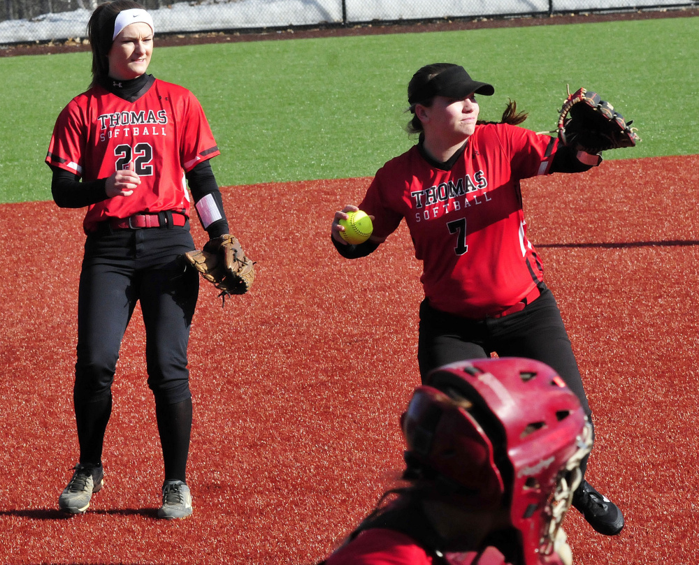 Thomas pitcher Sydney LeBourveau throws to first base during a March 30 game against Colby.