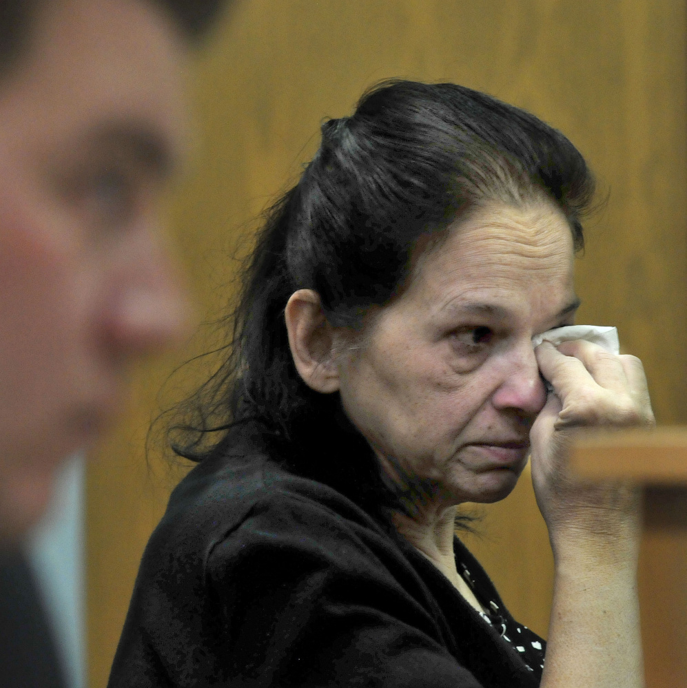 Linda Janeski, current owner of Dakota, a dog that has been ordered to be euthanized after repeated attacks on other dogs, wipes tears away Tuesday after Judge Valerie Standfill refused to reverse the decision in Waterville District Court. Janeski has appealed the decision.