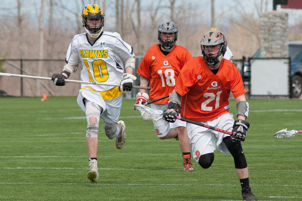 Maranacook/Winthrop sophomore midfielder Alex Nuce, left, tries to chase after Gardiner's Sloan Berthiaume (21) and Parker Hinkley during a Kennebec Valley Athletic Conference Class B game Tuesday morning at Kents Hill.