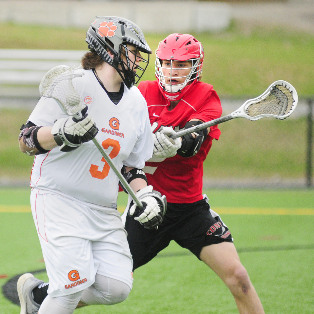 Gardiner's Michael Poirier, left, tries to get past Cony defender Nate Foye during a Kennebec Valley Athletic Conference Class B game Thursday at Lincoln Academy in Newcastle.